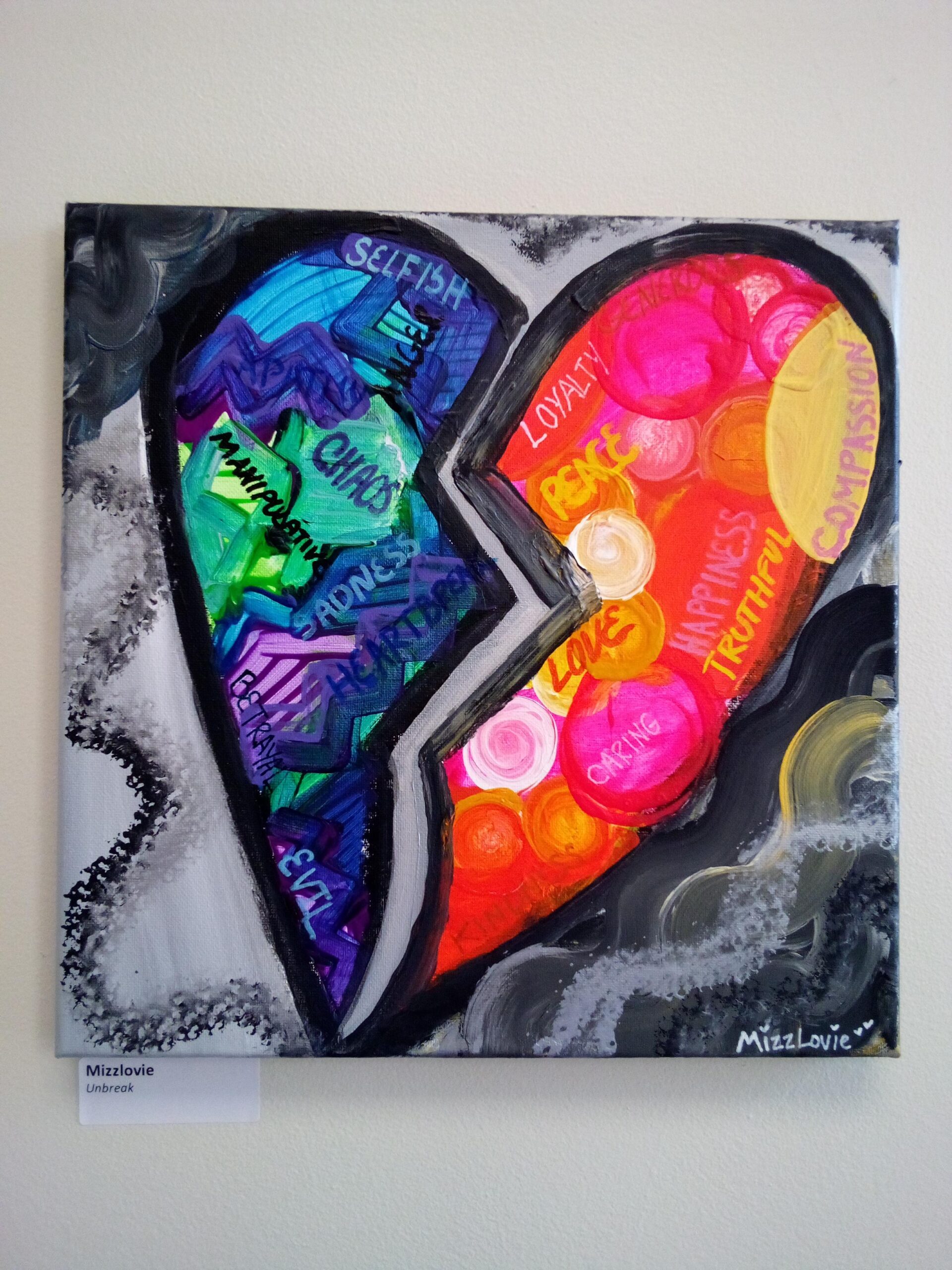 [Artist: Mizzlovie   Title: Unbreak]
This piece represents how abuse & negativity affects the heart and how positive things can help the heart to heal. Each side of the heart represents the different emotions that either bring heartbreak or help to bring happiness to our lives.